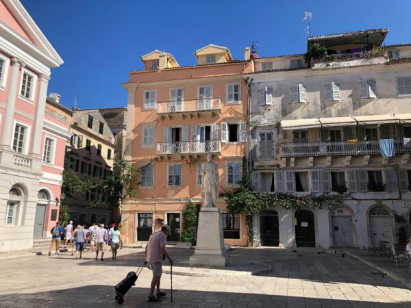 People Walking on the Public Square in Corfu, Greece.