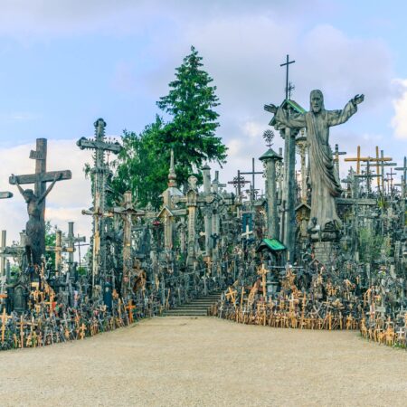 Hill of Crosses in Lithuania on a hot summer day with blue skies.