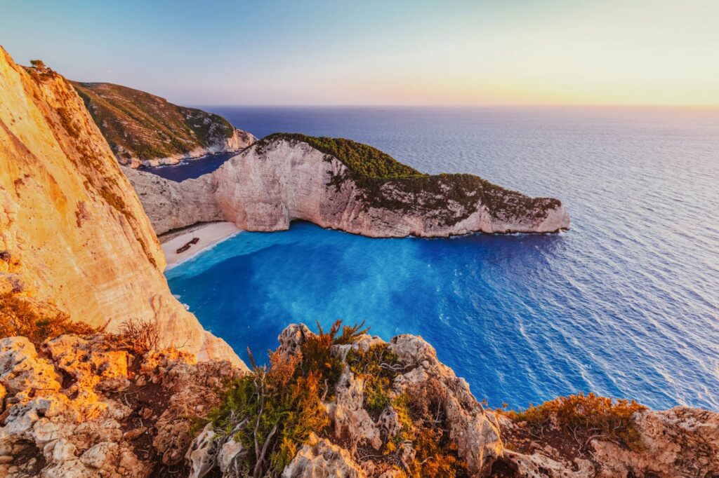 Navagio shipwreck beach in Zakynthos Greece at sunset