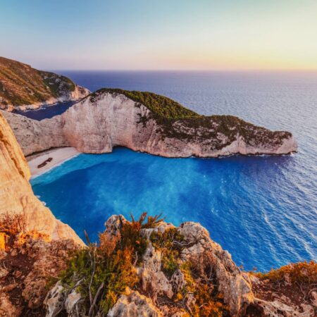 Navagio shipwreck beach in Zakynthos Greece at sunset