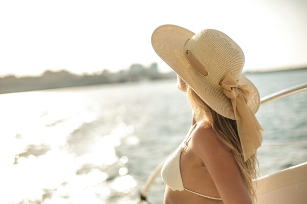 Tender traveling woman on board of sailing yacht