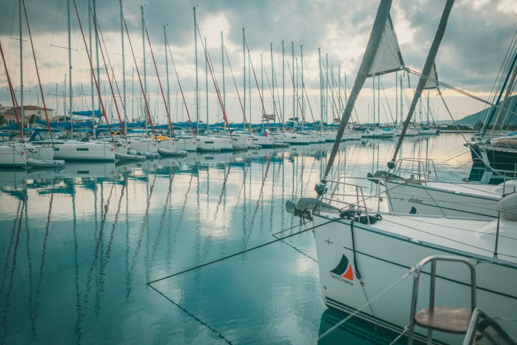 Travel around Greece yachts in Ionic Sea. Turquoise clear water beach travel by yachts