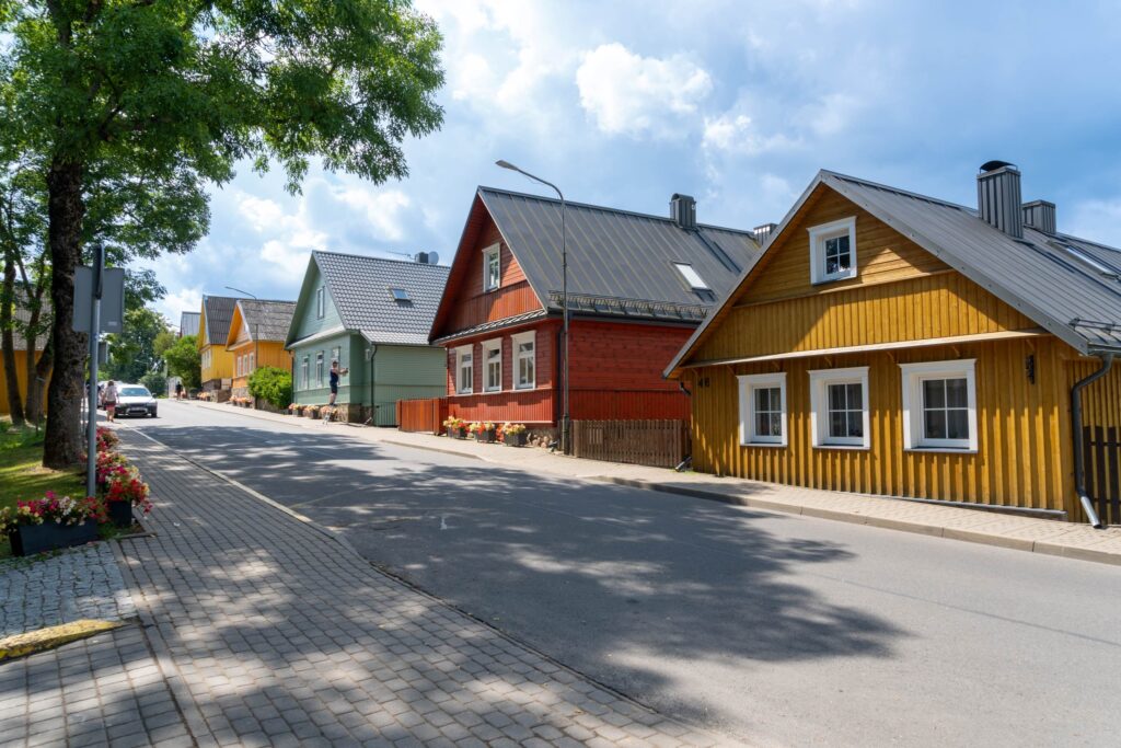 Trakai, Lithuania; 06 26 2023: Small houses in the village of Trakai in Lithuania. Colored houses with blue sky with clouds.